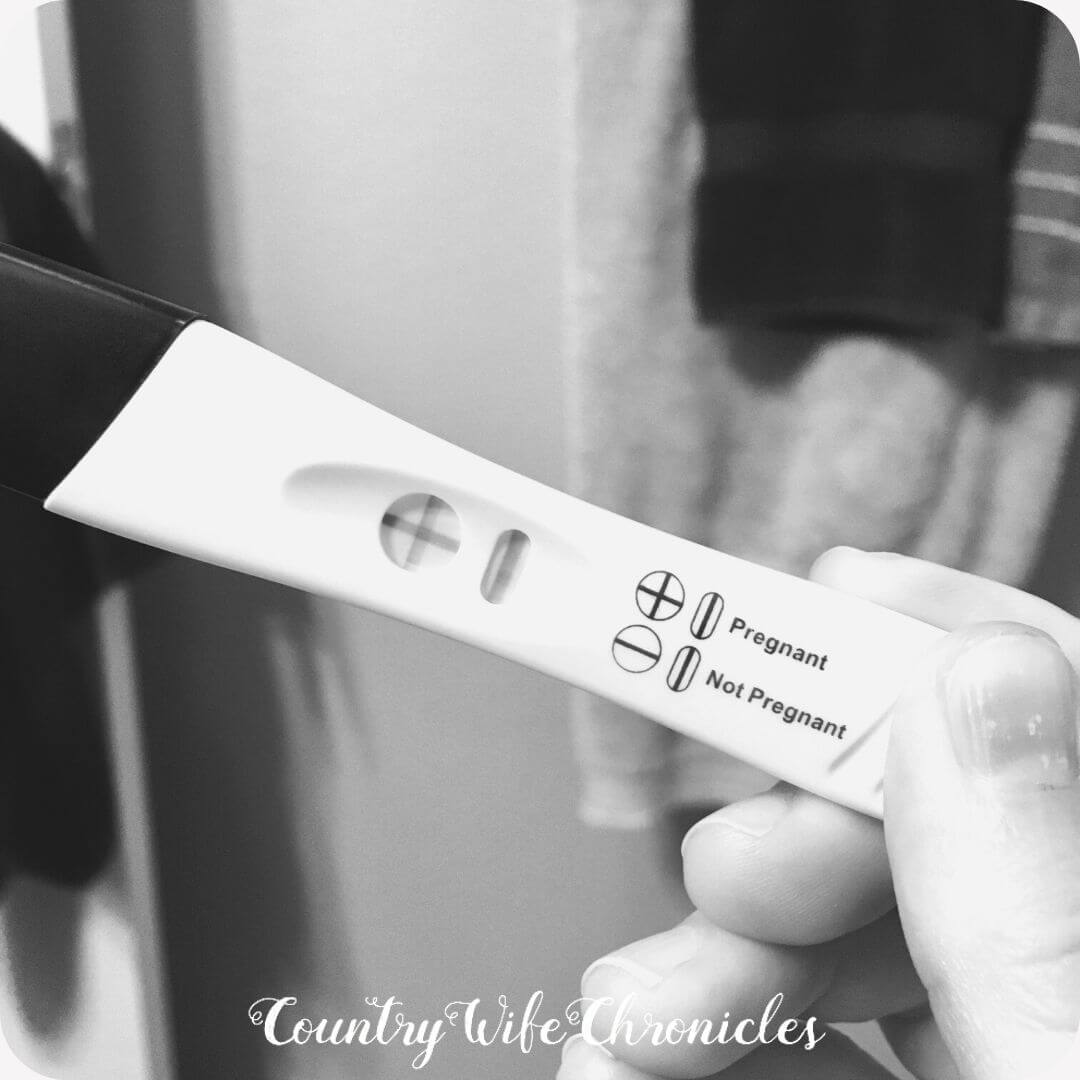 black and white image of positive pregnancy test